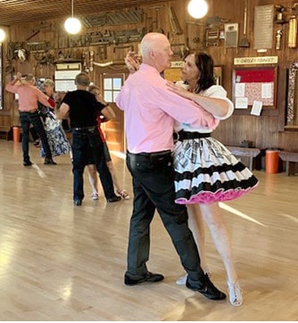 Couples learning the waltz in a ballroom instruction class in Grants Pass, Oregon