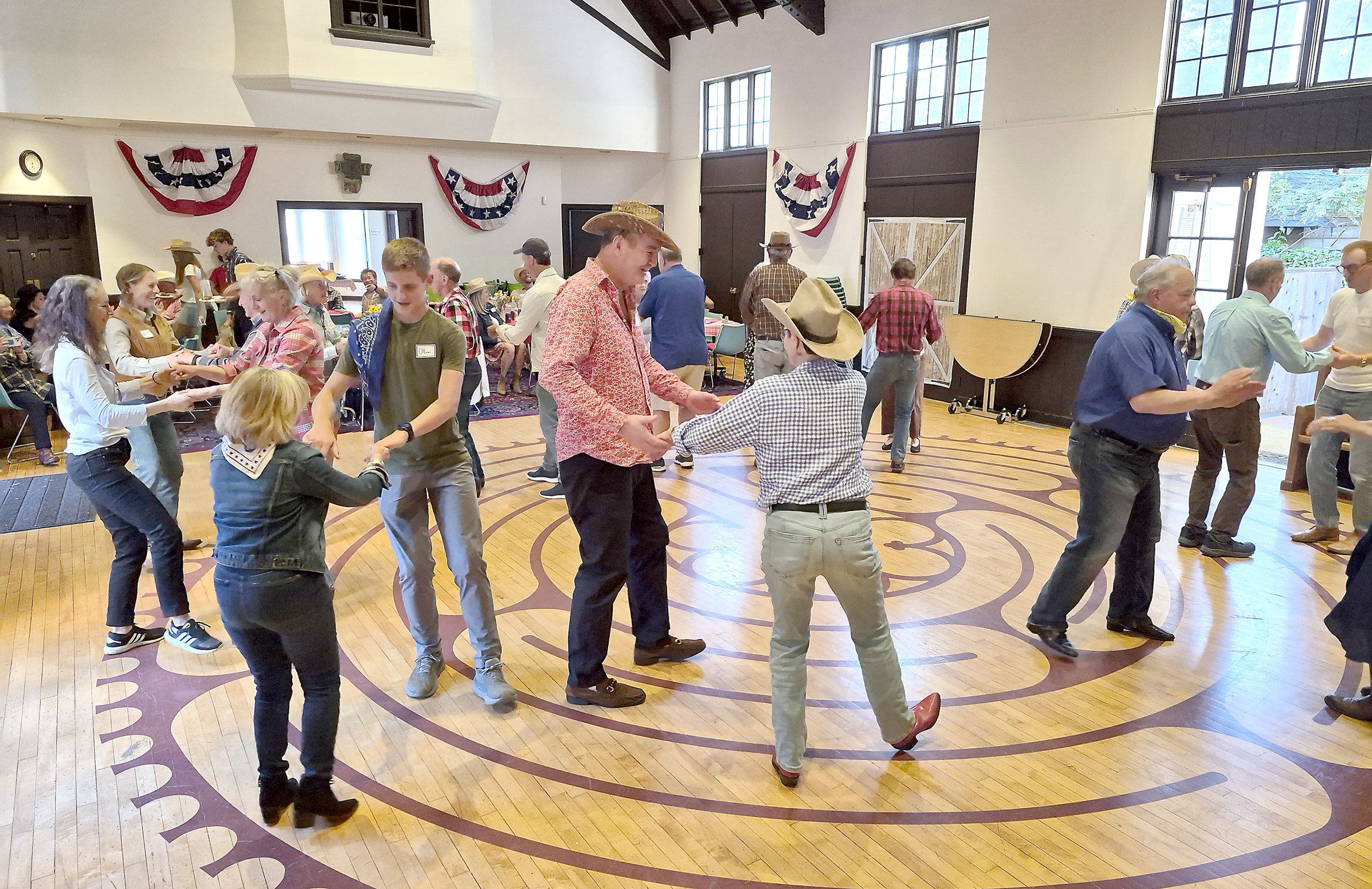 Church spring fling barn dance with couples in colorful western attire in Northern California
