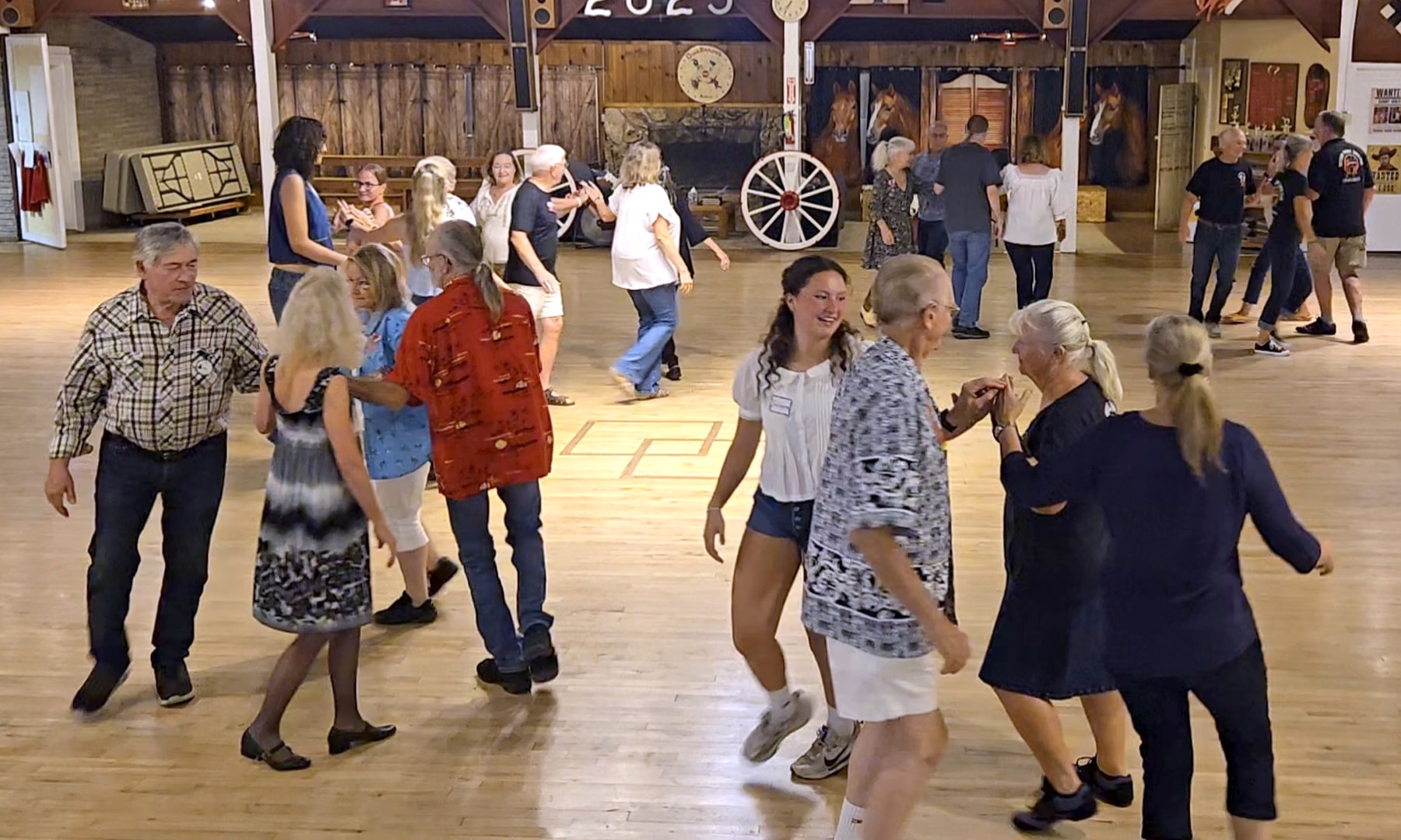 Crowd enjoying a barn dance community event